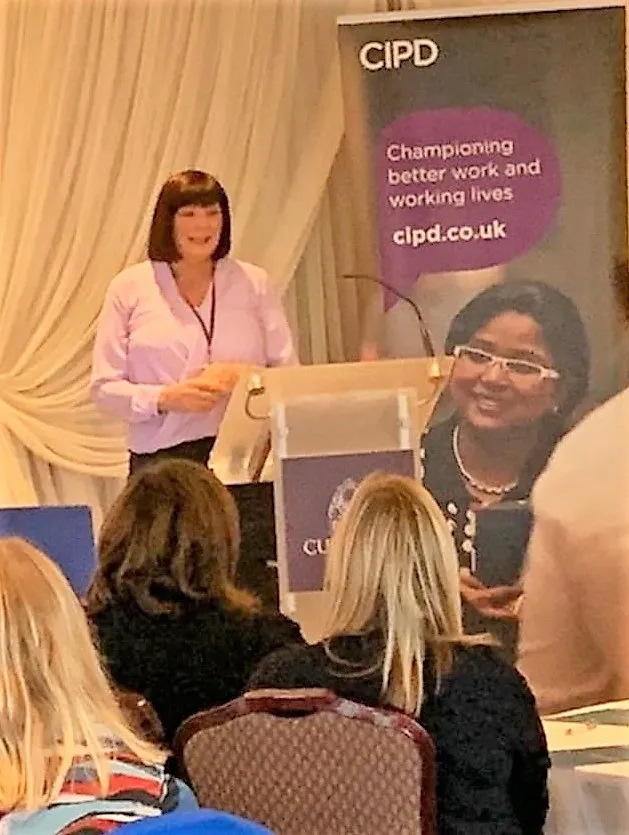Anne McGale standing at podium at CIPD Culloden